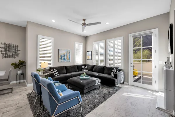 a living room with furniture and a large window