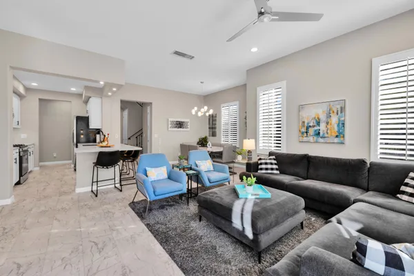 a living room with furniture and a large window