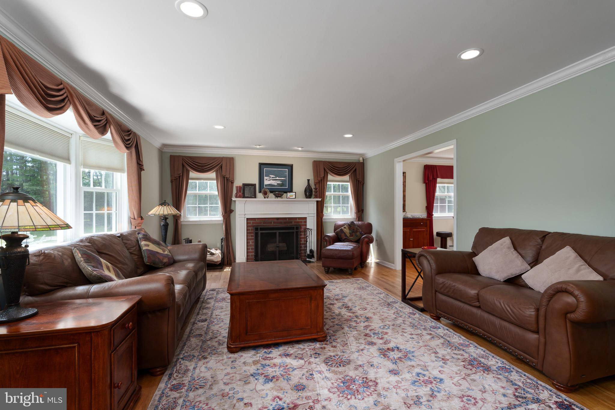 56 Valley Road Lambertville, NJ 08530 - Photo 17 of 49 a living room with furniture flat screen tv and a fireplace