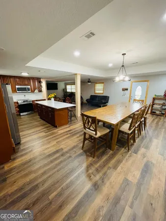 a bedroom with two beds and a dresser