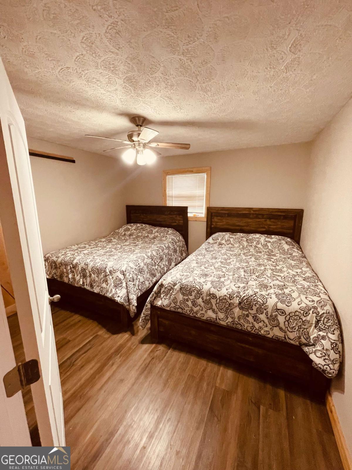 147 McLoon Road Hazlehurst, GA 31539 - Photo 12 of 38 a bedroom with two beds and a dresser