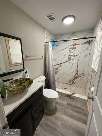 a view of a door with wooden floor