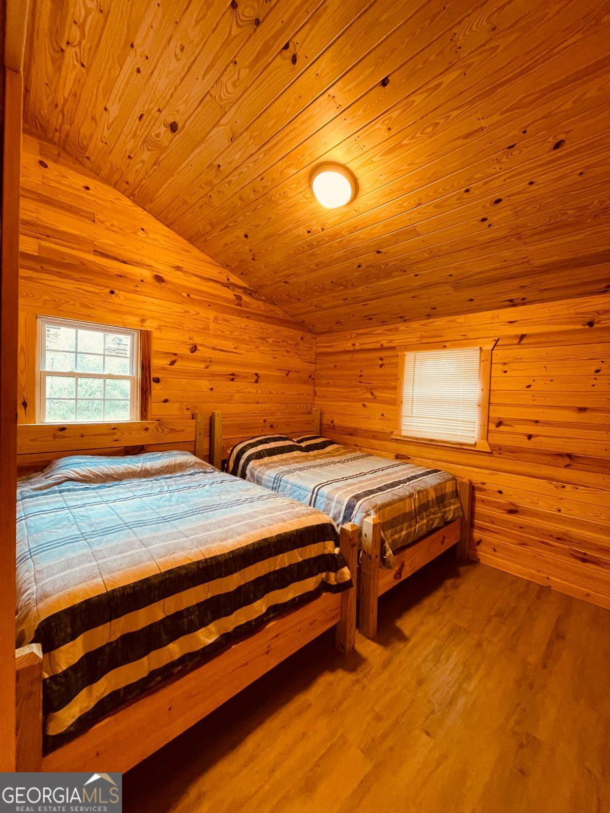 147 McLoon Road Hazlehurst, GA 31539 - Photo 16 of 38 a bedroom with a bed and window