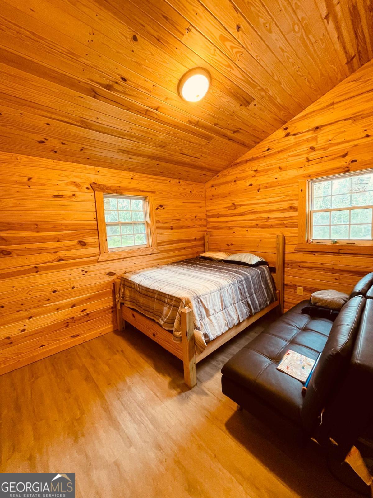 147 McLoon Road Hazlehurst, GA 31539 - Photo 17 of 38 a bedroom with two bed and a night stand