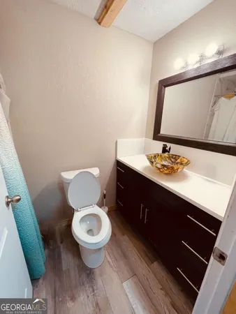 a view of kitchen and wooden floor