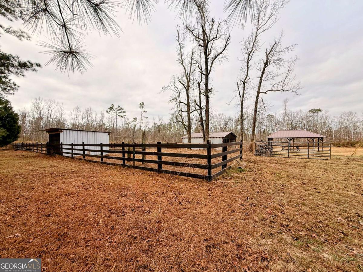147 McLoon Road Hazlehurst, GA 31539 - Photo 25 of 38 a view of a yard with wooden fence