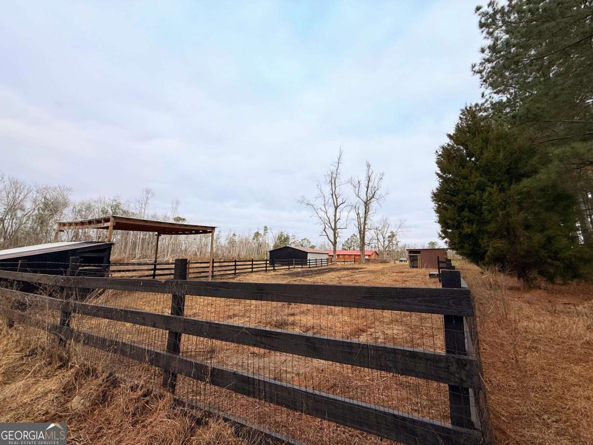 147 McLoon Road Hazlehurst, GA 31539 - Photo 30 of 38 a view of a pathway with a wrought fence