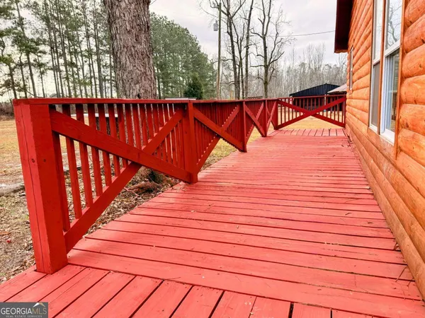 a view of outdoor space with deck and tree