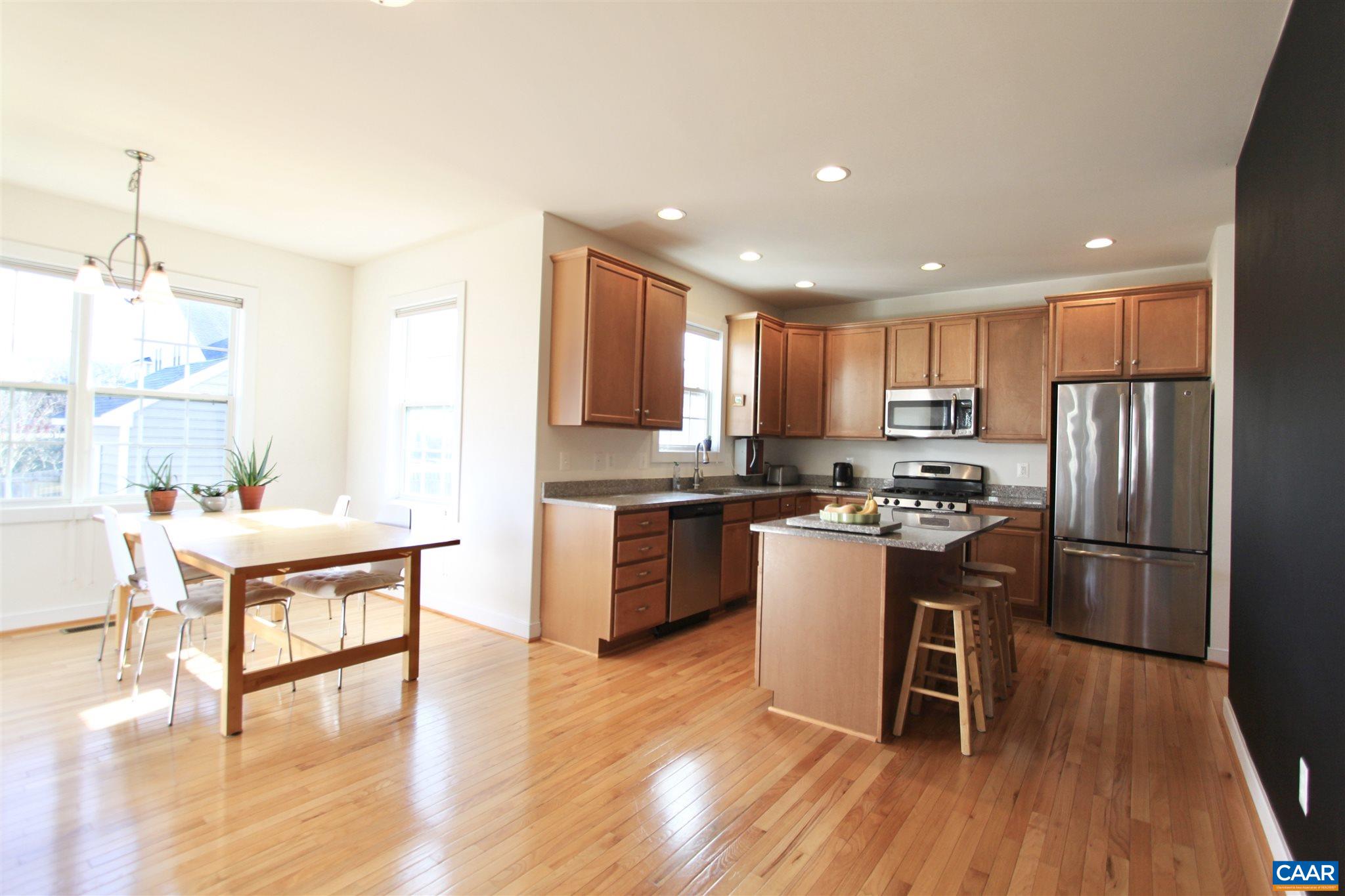 5441 Park Road Crozet, VA 22932 - Photo 11 of 30 a kitchen with a refrigerator a sink dishwasher a stove and white cabinets with wooden floor