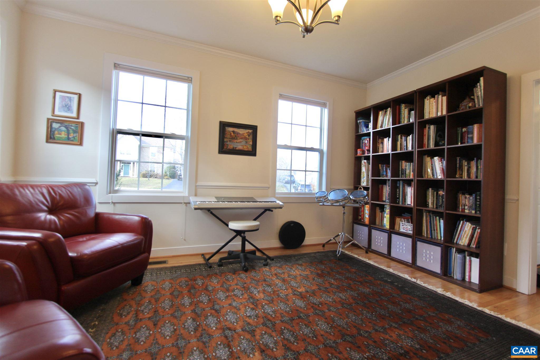 5441 Park Road Crozet, VA 22932 - Photo 3 of 30 a living room with furniture and a book shelf