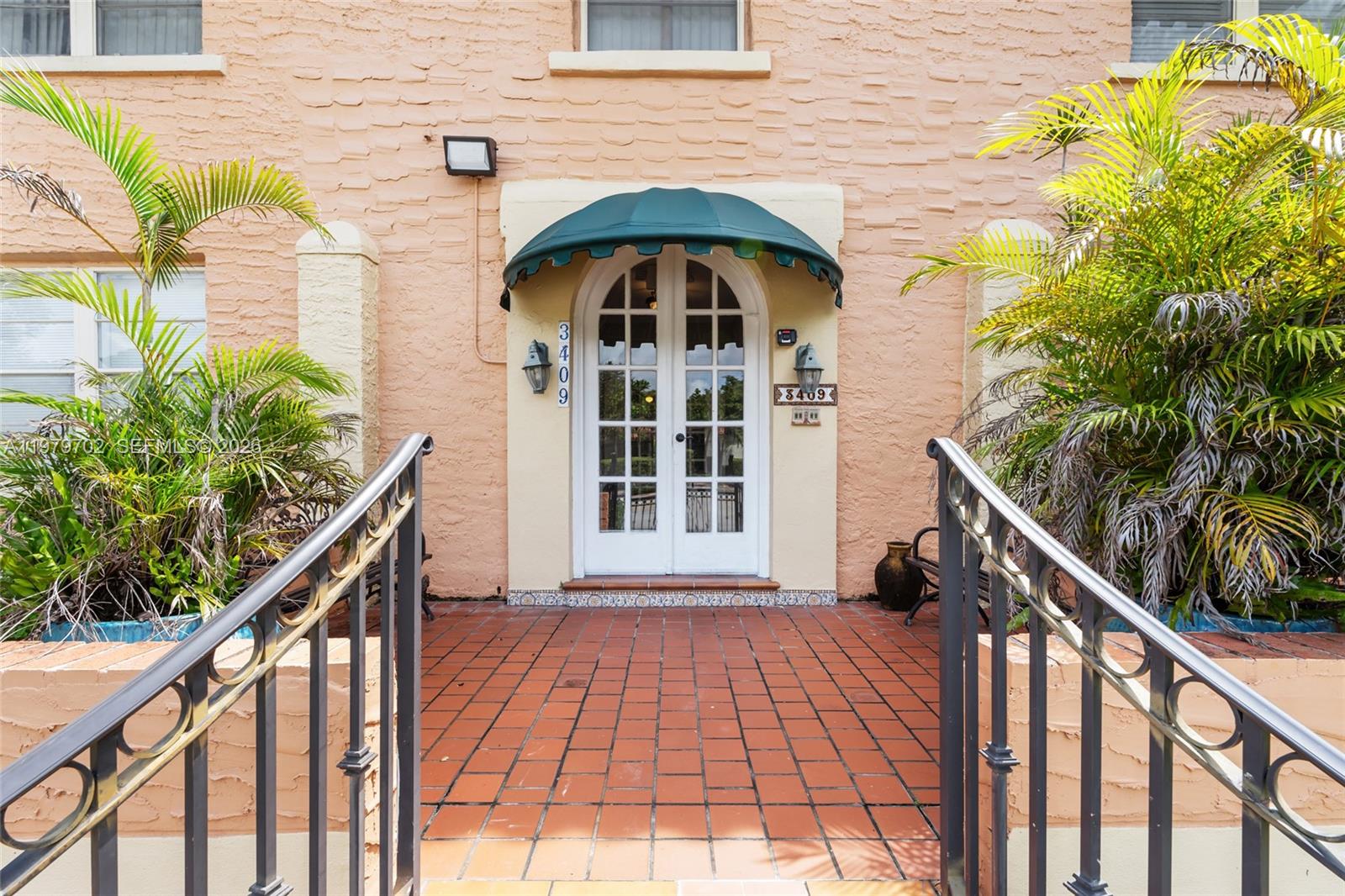 3409 South Le Jeune Road Coral Gables, FL 33134 - Photo 30 of 53 a view of a balcony with wooden floor and fence