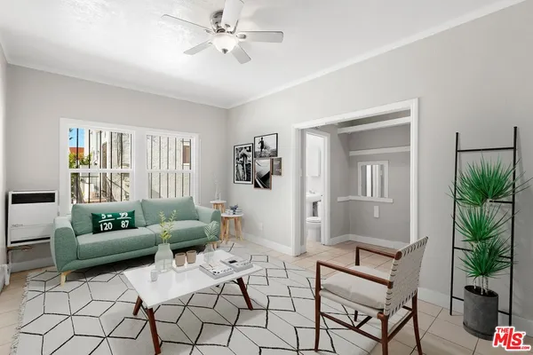 a living room with furniture and a window
