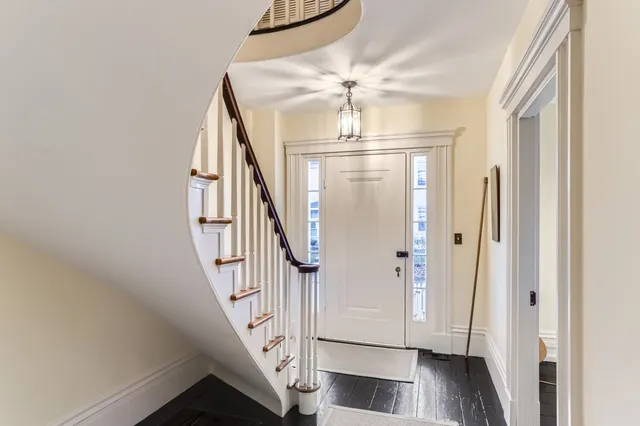 a view of a livingroom with furniture and workspace