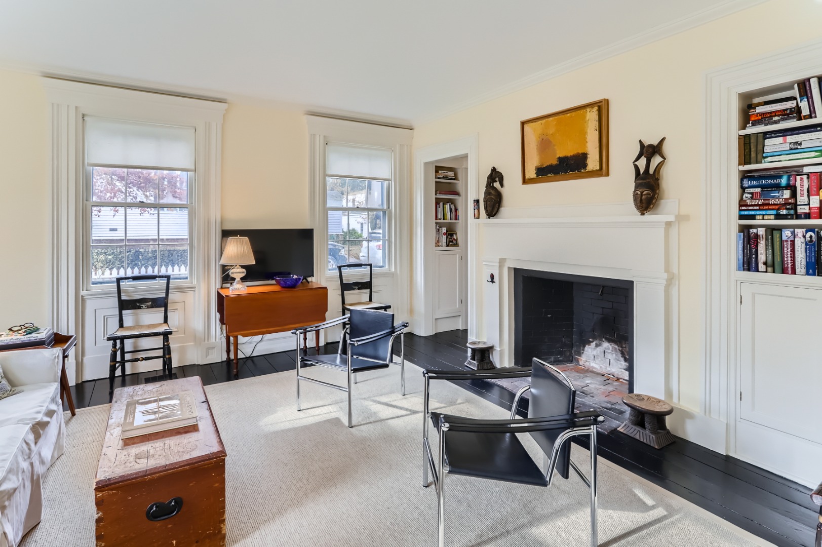 27 Spring Street Vineyard Haven, MA 02568 - Photo 26 of 59 a living room with furniture a rug and a fireplace