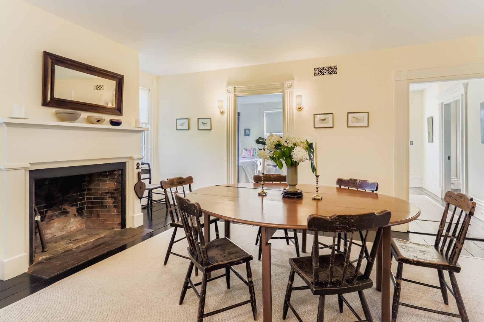 27 Spring Street Vineyard Haven, MA 02568 - Photo 32 of 59 a view of a dining room with furniture and a fireplace