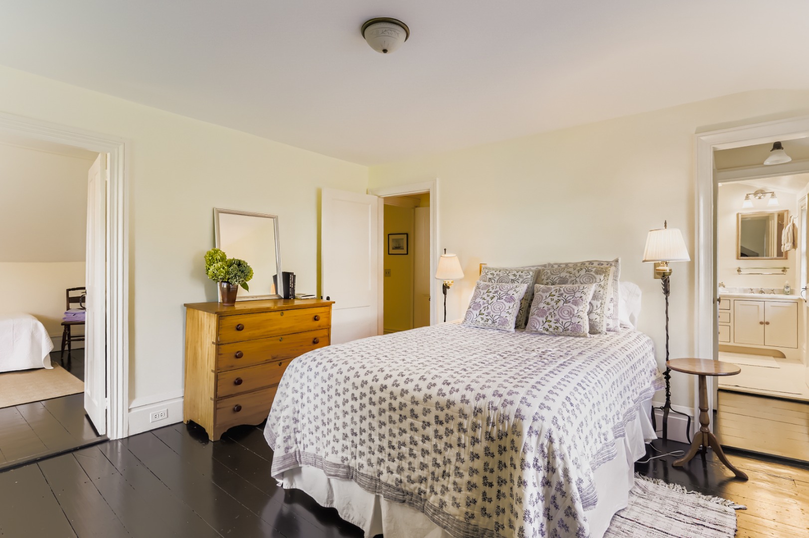 27 Spring Street Vineyard Haven, MA 02568 - Photo 42 of 59 a bedroom with a bed and wooden floor