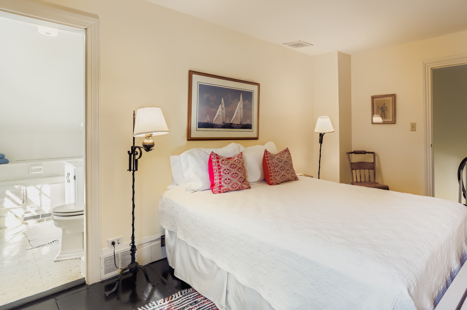 27 Spring Street Vineyard Haven, MA 02568 - Photo 45 of 59 a bedroom with a bed and a painting on the wall