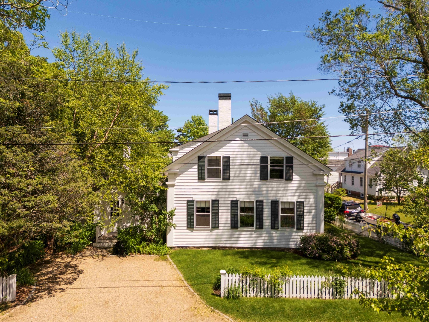 27 Spring Street Vineyard Haven, MA 02568 - Photo 57 of 59 a front view of a house with a garden and plants
