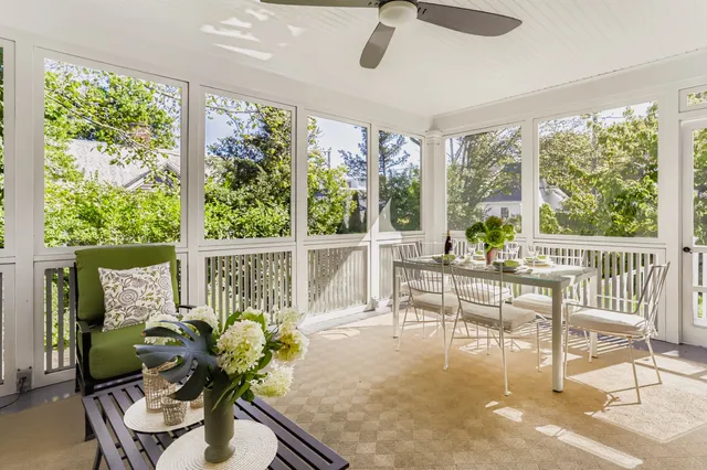 a view of a dining room with furniture and window
