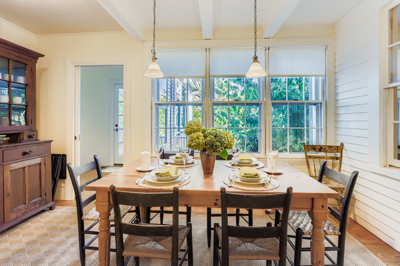 27 Spring Street Vineyard Haven, MA 02568 - Photo 9 of 59 a view of a dining room with furniture large windows and wooden floor