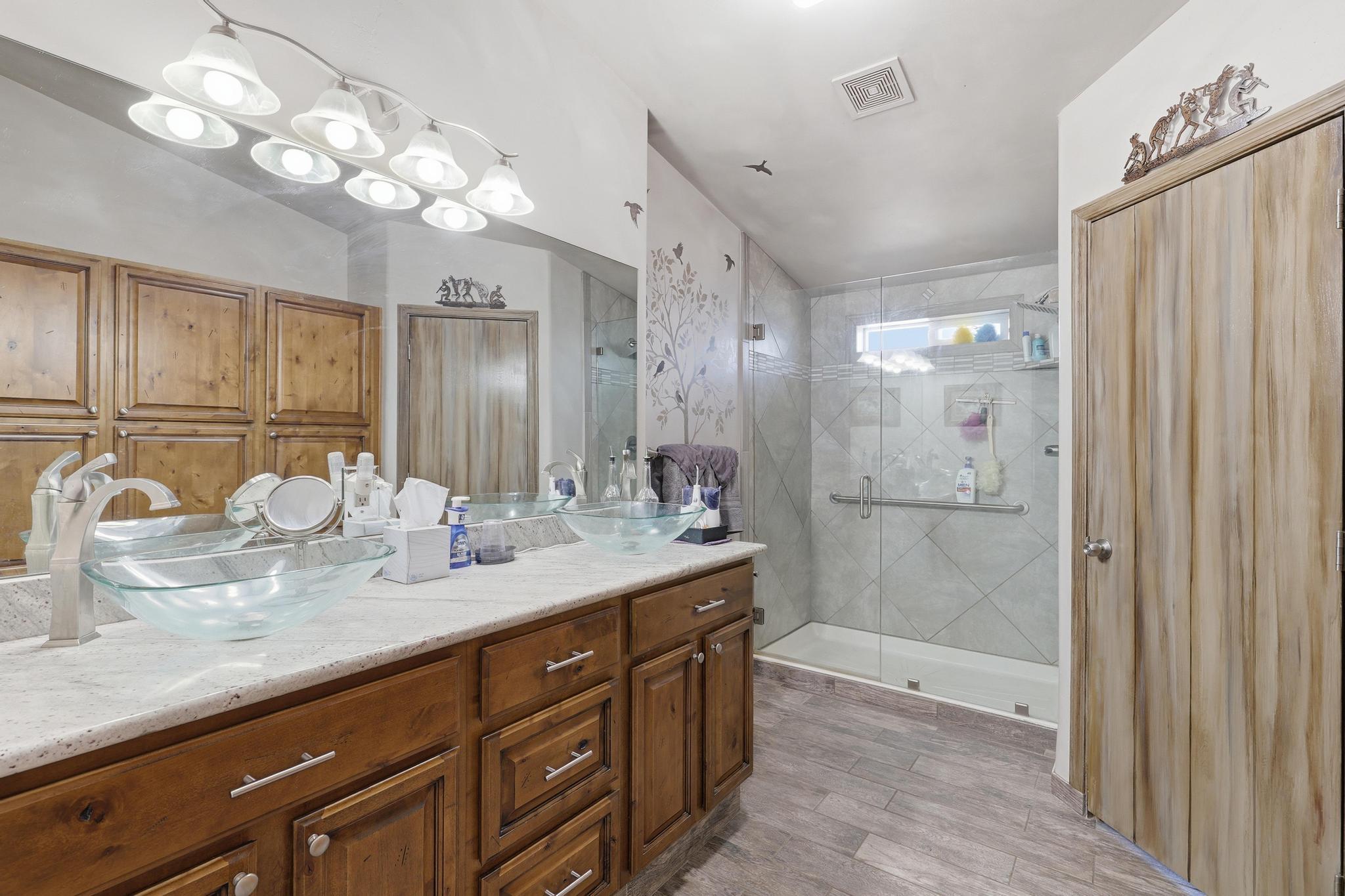 1211 Heather Circle Payson, AZ 85541 - Photo 14 of 51 a bathroom with a granite countertop sink a mirror and a shower