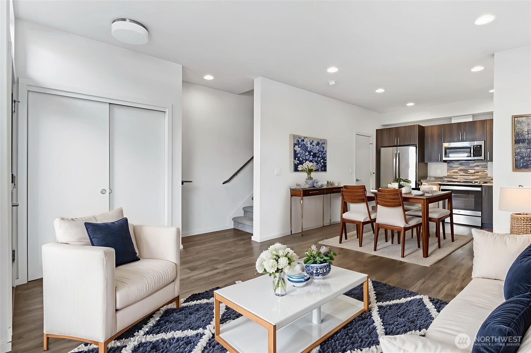 6917 Carleton Avenue South, Unit B Seattle, WA 98108 - Photo 1 of 25 a living room with furniture kitchen view and a dining table