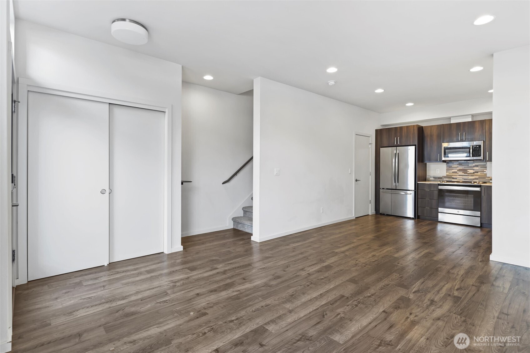 6917 Carleton Avenue South, Unit B Seattle, WA 98108 - Photo 11 of 25 a view of a kitchen with a refrigerator and wooden floor