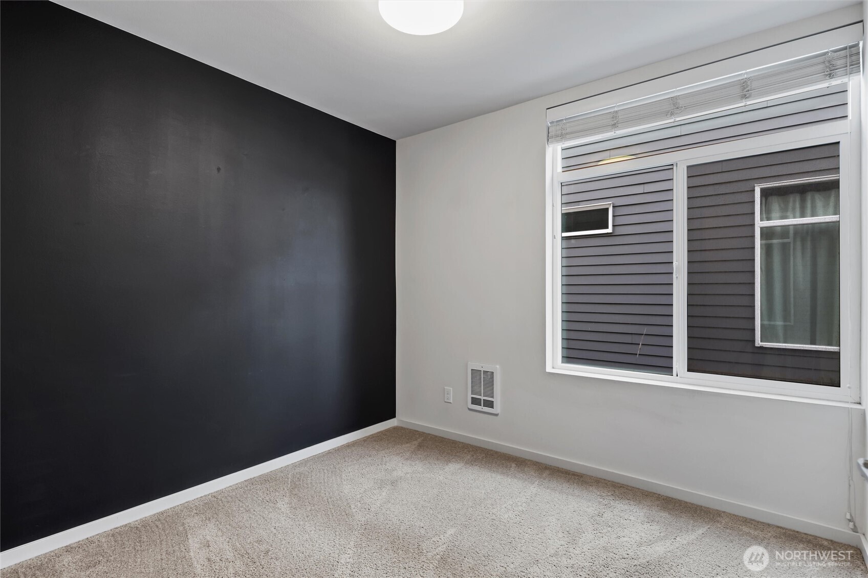 6917 Carleton Avenue South, Unit B Seattle, WA 98108 - Photo 14 of 25 a view of a window in an empty room