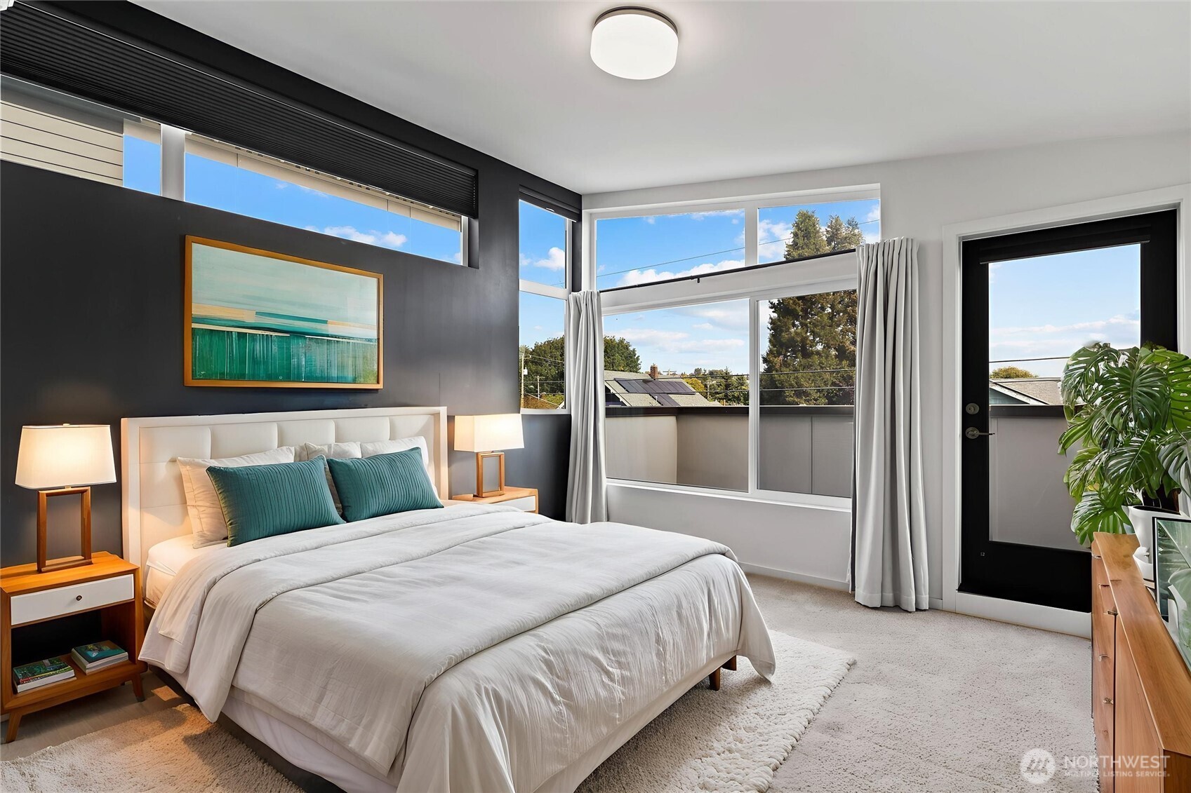 6917 Carleton Avenue South, Unit B Seattle, WA 98108 - Photo 3 of 25 a bedroom with a bed and a large window