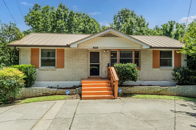 a front view of a house with garage