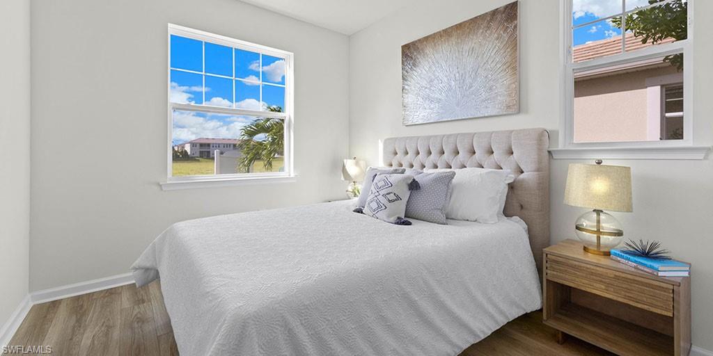 4653 Arboretum Circle, Unit 104 Naples, FL 34112 - Photo 13 of 21 a bedroom with bed and window