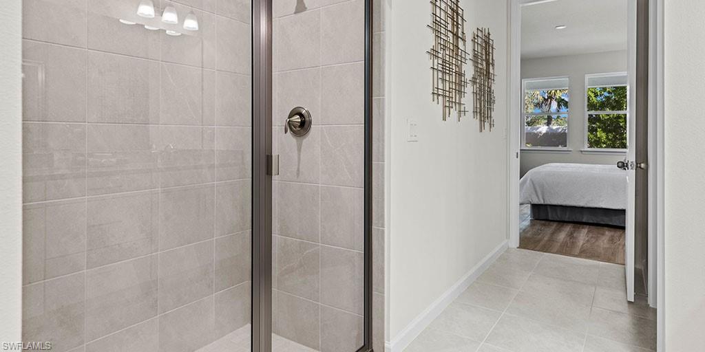 4653 Arboretum Circle, Unit 104 Naples, FL 34112 - Photo 15 of 21 a view of a room that has a bed in it