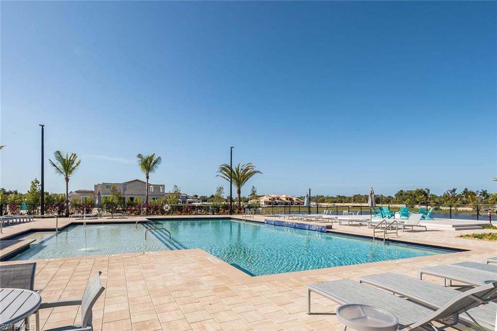 4653 Arboretum Circle, Unit 104 Naples, FL 34112 - Photo 20 of 21 a view of swimming pool and lake view