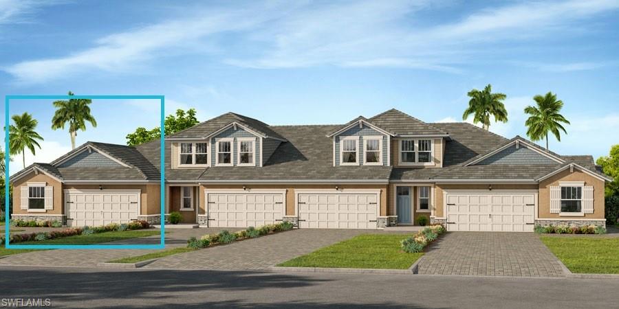 4653 Arboretum Circle, Unit 104 Naples, FL 34112 - Photo 3 of 21 a front view of a house with a yard and garage