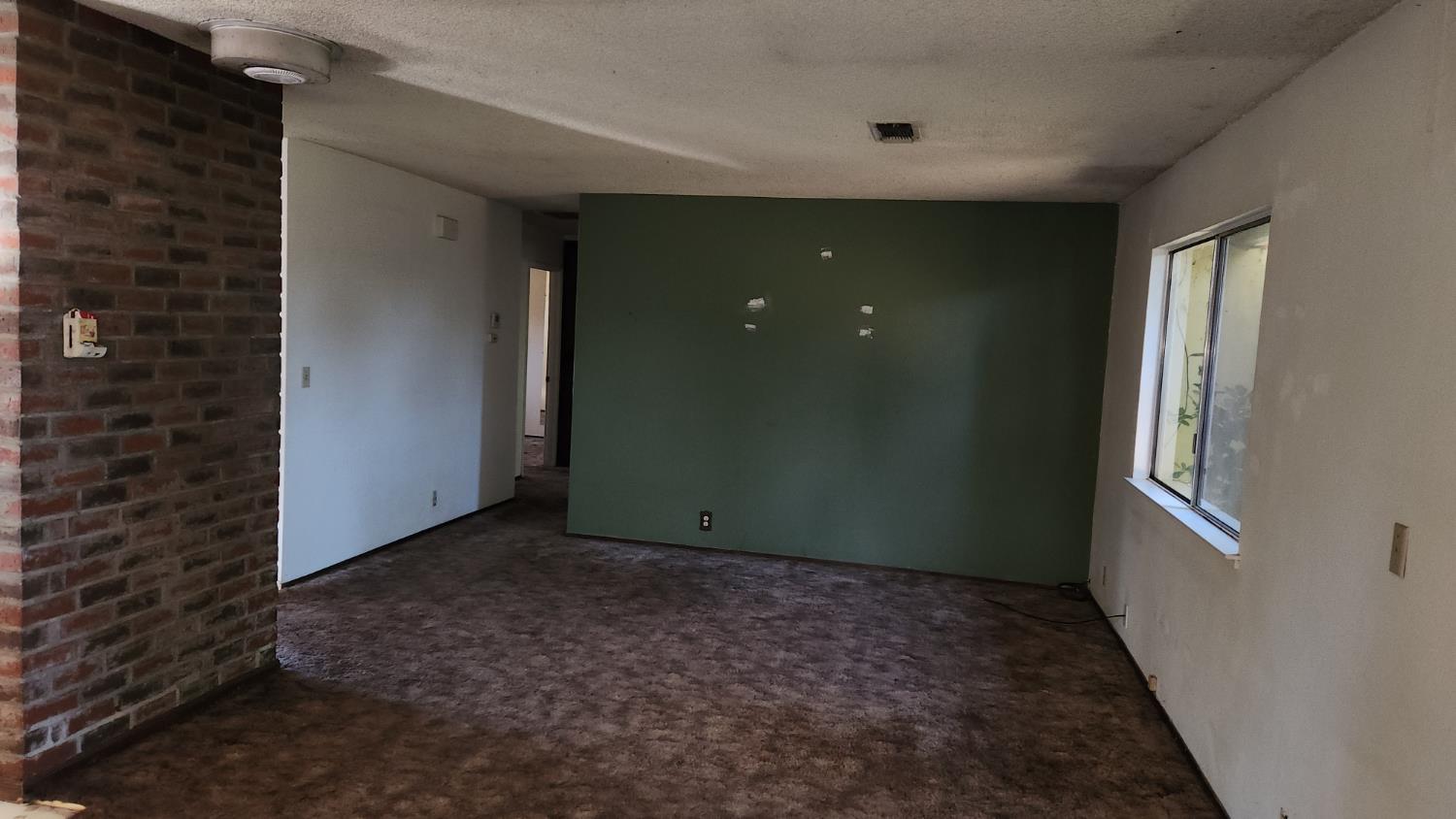 2332 Venus Way Redding, CA 96002 - Photo 11 of 27 a view of an empty room with a window
