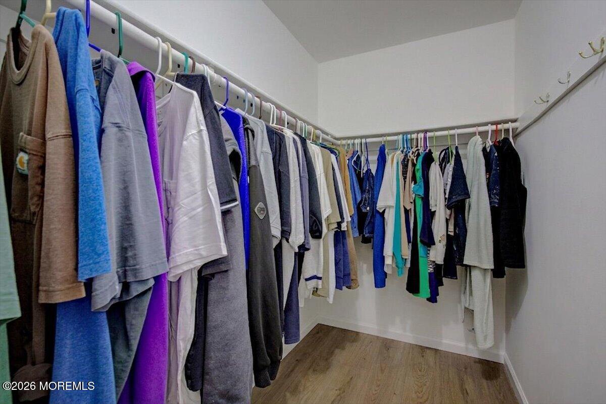 16 D Spring Street, Unit 50 Whiting, NJ 08759 - Photo 21 of 28 a view of walk in closet with clothes