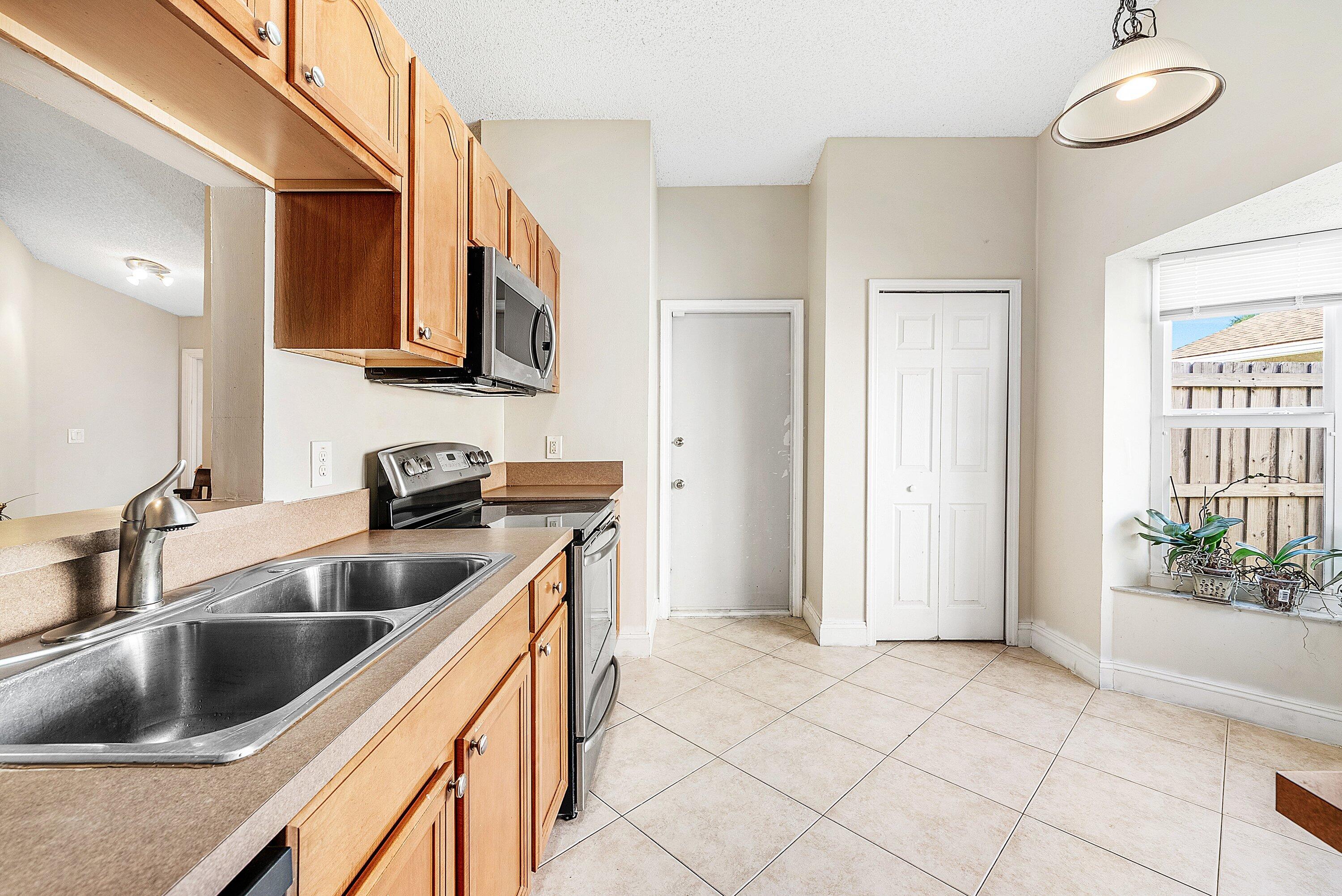 16 Ripley Way Boynton Beach, FL 33426 - Photo 12 of 29 Pantry and Garage Access