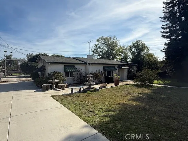 a view of house with yard outdoor seating and entertaining space