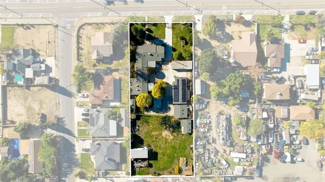 an aerial view of residential houses with outdoor space