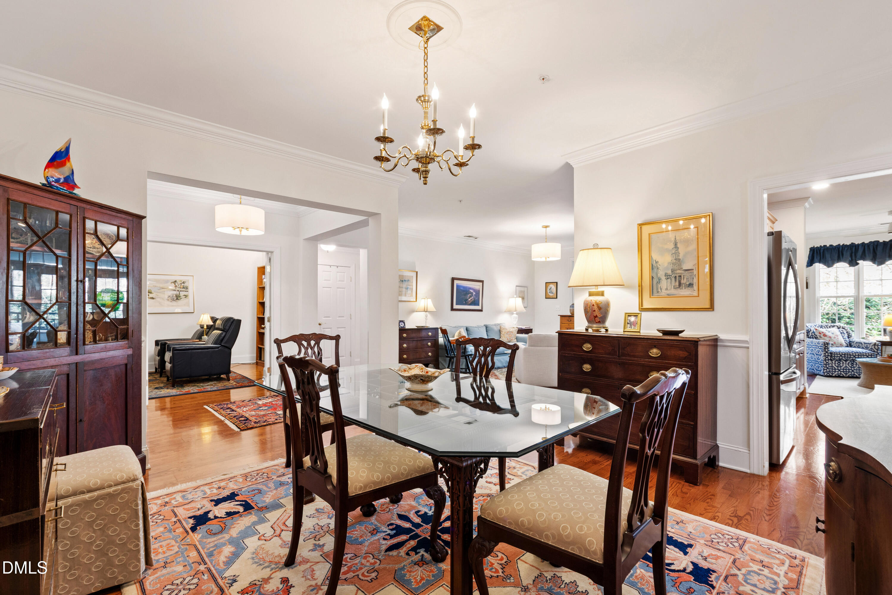 3700 Baron Cooper Pass, Unit 105 Raleigh, NC 27612 - Photo 36 of 49 a view of a dining room with furniture and wooden floor
