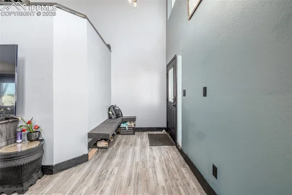 a room with wooden floor and furniture