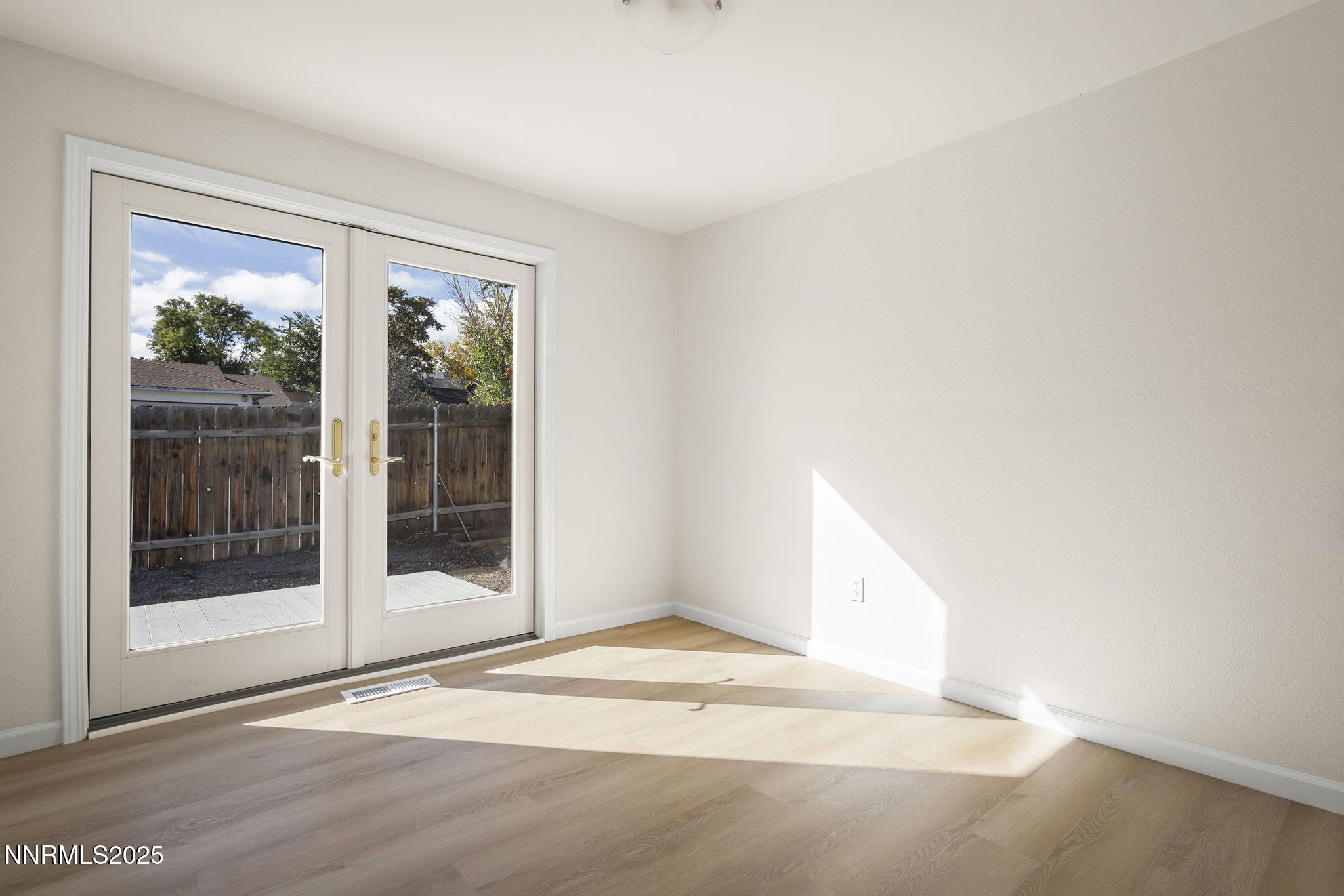 6780 Flower Street, Unit FENCED CORNER LOT Reno, NV 89506 - Photo 17 of 31 Bedroom with French doors