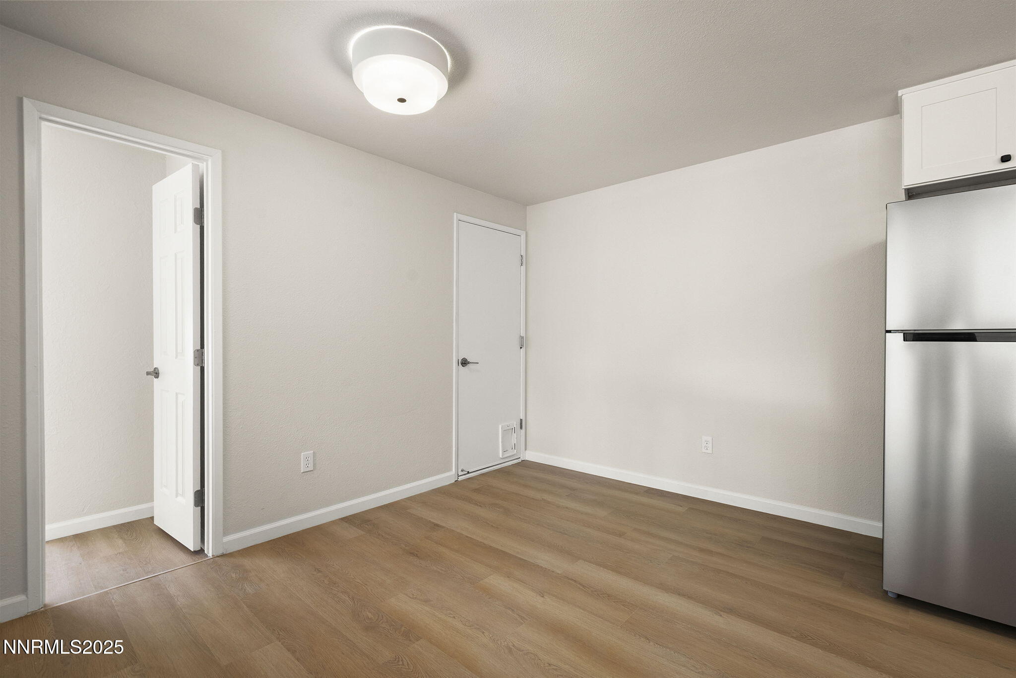 6780 Flower Street, Unit FENCED CORNER LOT Reno, NV 89506 - Photo 29 of 31 Dining Garage Door