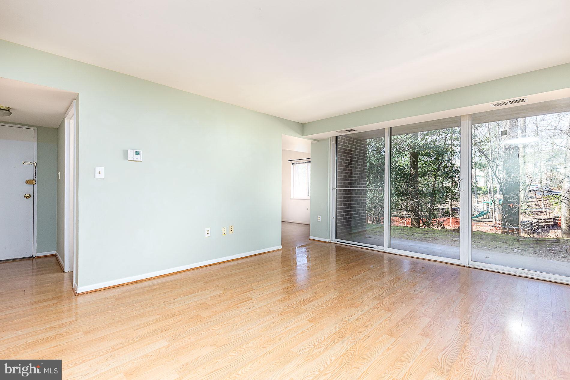 1530 Northgate Square, Unit 2A Reston, VA 20190 - Photo 3 of 22 SLIDING DOOR TO TREED AREA