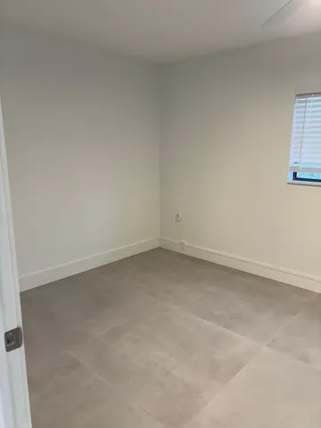 an empty room with kitchen