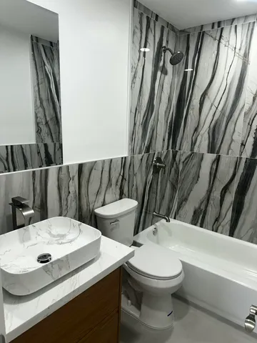 a bathroom with a sink and mirror