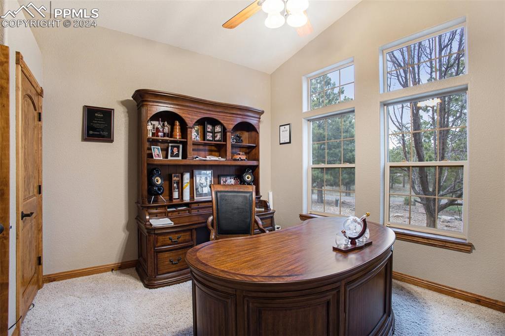 11628 Shaugnessy Road Colorado Springs, CO 80908 - Photo 17 of 50 a room with furniture and window