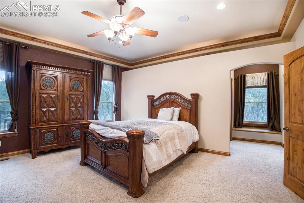 11628 Shaugnessy Road Colorado Springs, CO 80908 - Photo 19 of 50 a bedroom with a bed and window