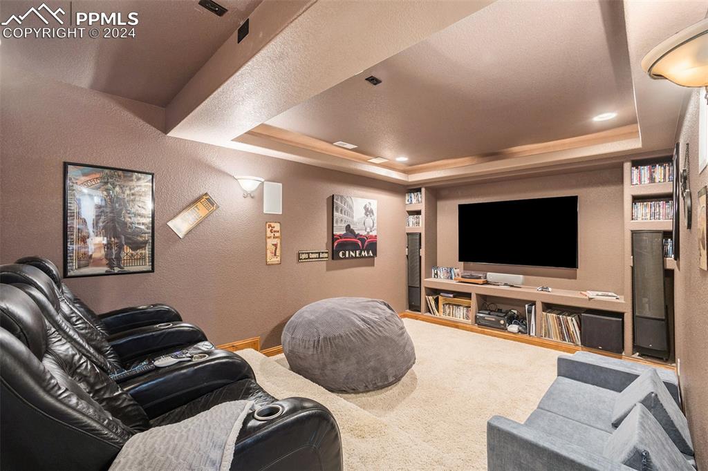 11628 Shaugnessy Road Colorado Springs, CO 80908 - Photo 26 of 50 a living room with furniture and a flat screen tv