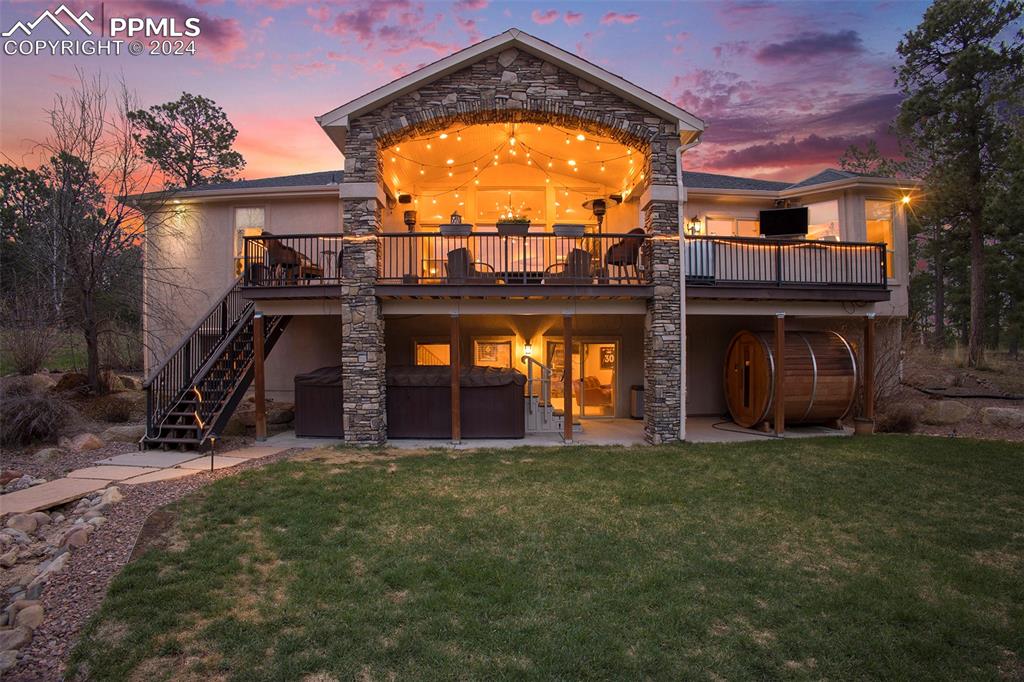 11628 Shaugnessy Road Colorado Springs, CO 80908 - Photo 34 of 50 a view of a house with a yard